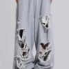 Abgenutzte graue melierte, weite Monster Joggers