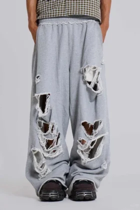 Abgenutzte graue melierte, weite Monster Joggers