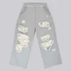 Abgenutzte graue melierte, weite Monster Joggers