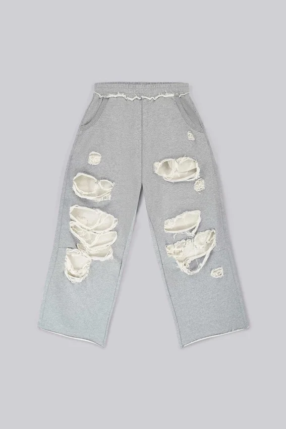 Abgenutzte graue melierte, weite Monster Joggers