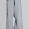 Abgenutzte graue melierte, weite Monster Joggers