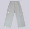 Abgenutzte graue melierte, weite Monster Joggers