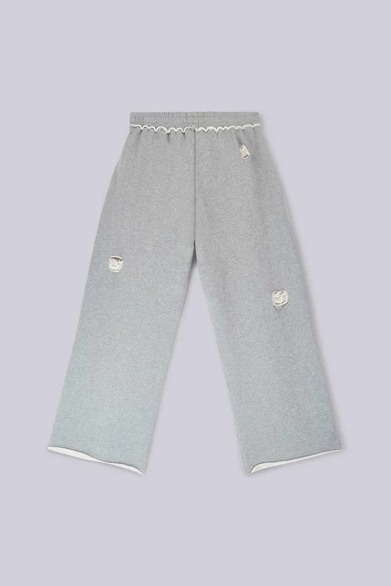 Abgenutzte graue melierte, weite Monster Joggers