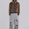 Abgenutzte graue melierte, weite Monster Joggers