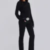 Einfarbige schwarze Thirteen-Jeans