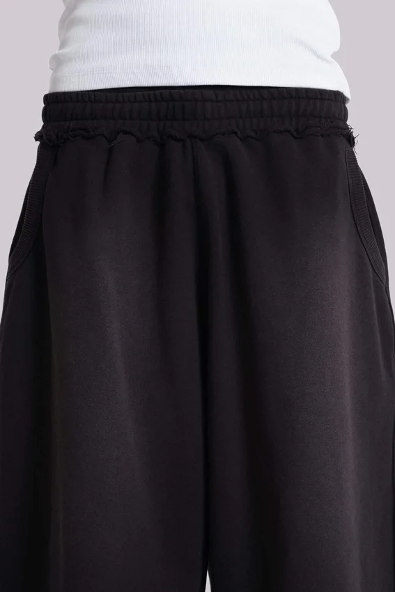 Gewaschene schwarze „Monster“ Jogger-Baggy-Shorts