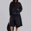Gewaschener schwarzer Hoodie mit Reißverschluss, Waffelpiqué-Futter und sonnenverblasster Optik