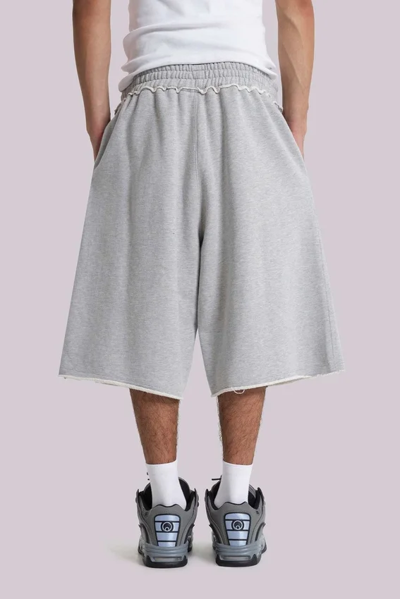 Grau melierte „Monster Joggers“ Baggy-Shorts