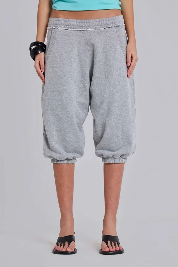 Grau melierte, verkürzte „Monster Joggers“