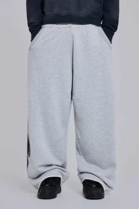 Grau melierte, weite Monster Joggers mit Gothic-Print
