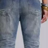 Mittelblaue, im Used-Look verarbeitete, geknitterte Drift-Flared-Jeans