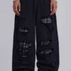 Monster Joggers mit Karomuster und Lagenlook