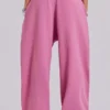 Rosa, weite Monster Joggers mit Umschlag