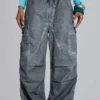 Schwarze Parachute Pants im Oil-Wash-Look