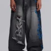 Schwarze Spike Airbrush XL Colossus Jeans mit Rissen