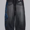 Schwarze Spike Airbrush XL Colossus Jeans mit Rissen
