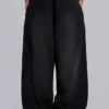 Schwarze, weite „Monster Joggers“ mit Umschlag