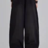 Schwarze, weite „Monster Joggers“ mit Umschlag