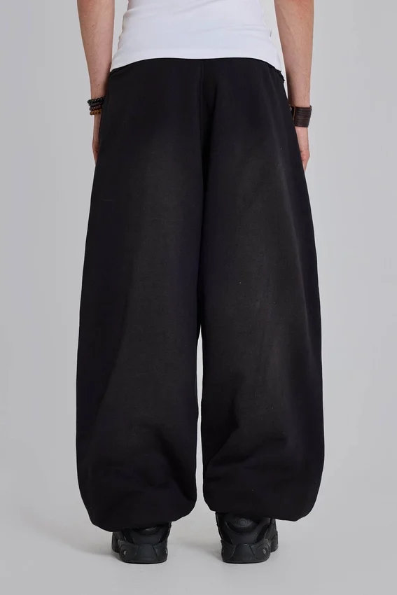 Schwarze, weite „Monster Joggers“ mit Umschlag