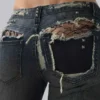 Tori-Jeans mit Low-Rise-Schnitt, Bootcut und Distressed-Effekt aus Spitze